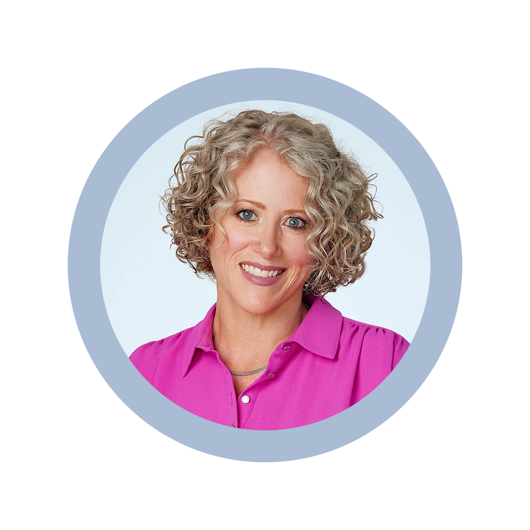 Nicole Cox headshot against light blue background