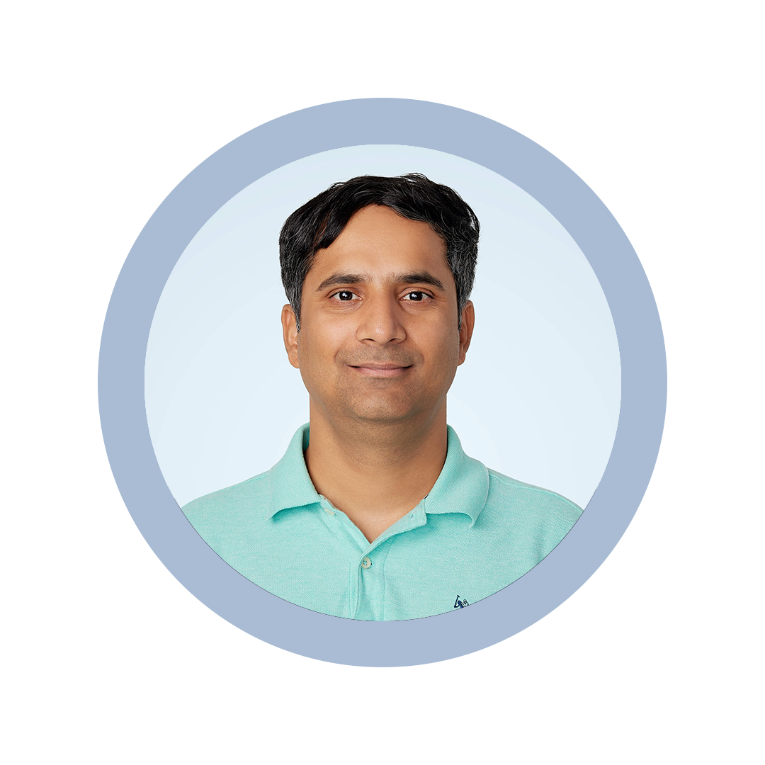 Roshan Wagle headshot against light blue background