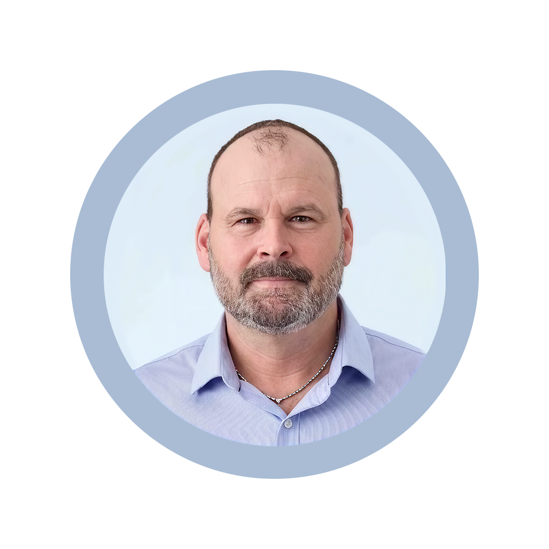 Sean Durham headshot against light blue background